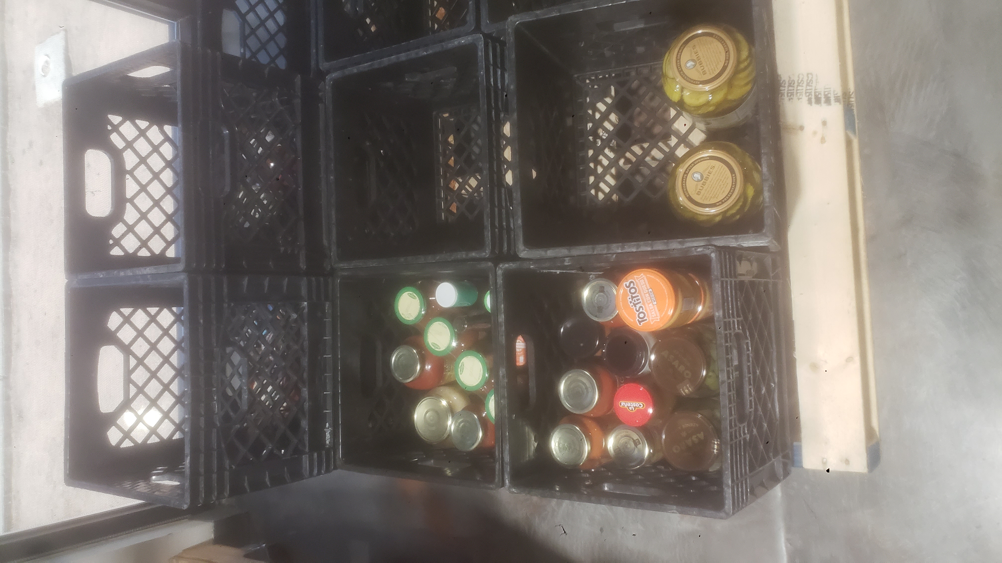 Crates of glass jars.
